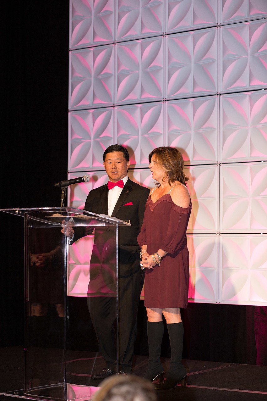 Co-Chairs Drs. Jon Yenari and Karen Hamad ask guests to fill out a donation card, as anonymous donor agreed to match up to $80,000.