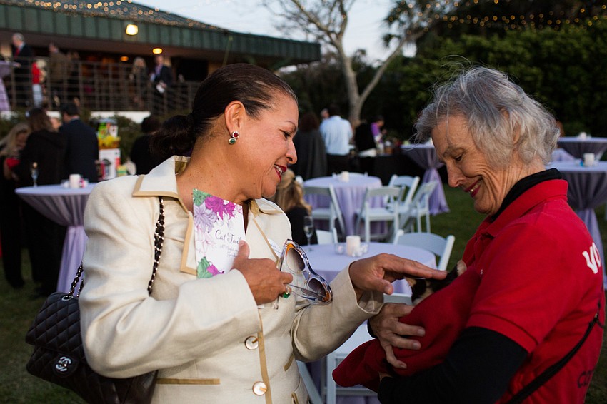 Maria Herrera Brown smiles as she pets Thyme.