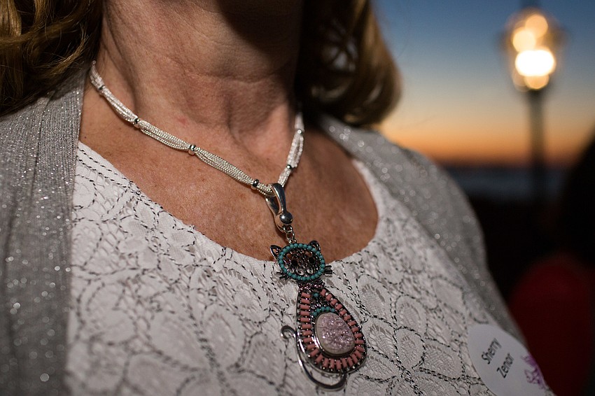 Sherry Zenor sports a cat necklace.