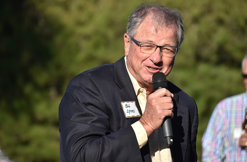 Whitney Beach Condominium Association President Bob Lyons speaks to the crowd.