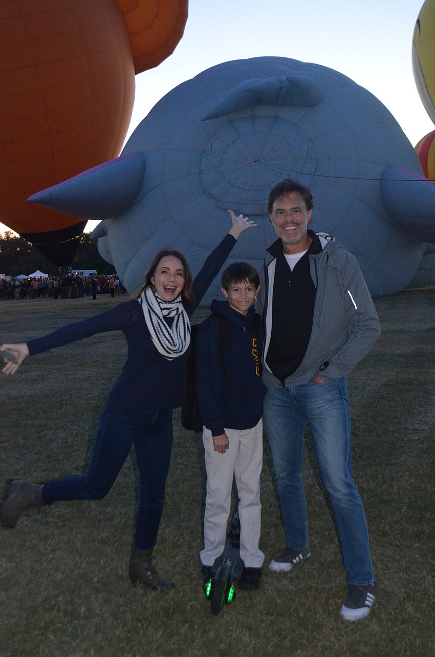 Sarasota's Tia Castle, Ace King and Doug King gather in front of an inflating Dumbo balloon.