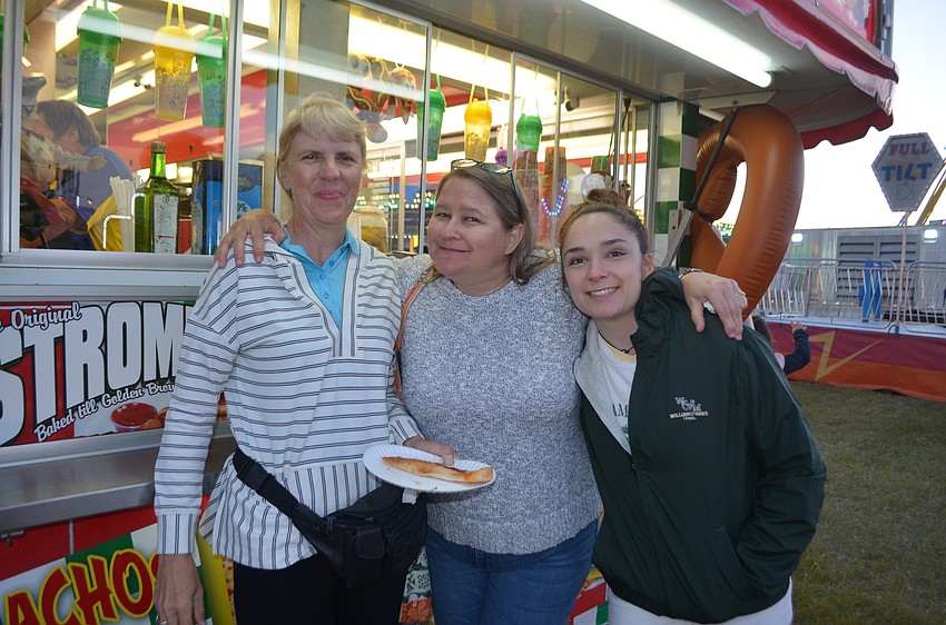 Sarasota's Lynn Deuitch, Sara Brenner and Autumn Brenner test the carnival food.