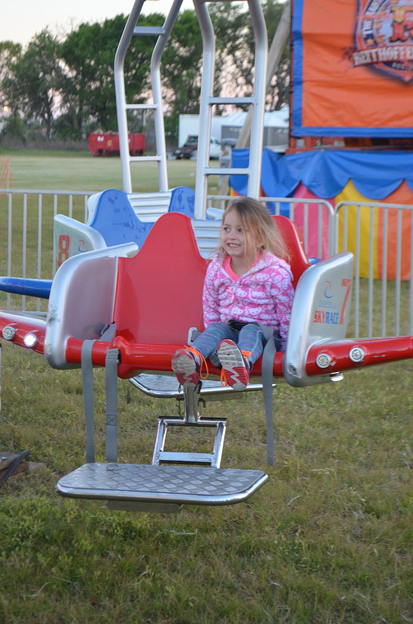 Sarasota's Matilyn Dibartolome gets ready to enjoy a carnival ride.