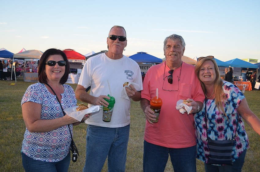 Jacksonville Beach's Renee and Rodney Sentz and Jacksonville's Tom and Faith Reagan grab a snack.