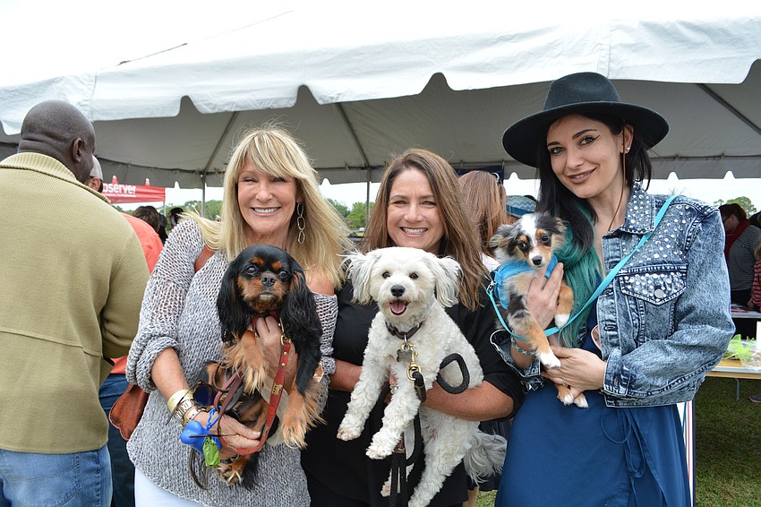 Sarasota's Lynn Barrie spends the day with her daughters, Jaymie Klauber and Zara Barrie. They hold their dogs, Edie, Robbie and Luka (left to right).