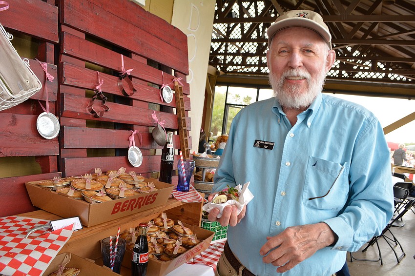 Longtime Honor volunteer Jay Crawley loads up on chocolate-covered strawberries for himself and friends.