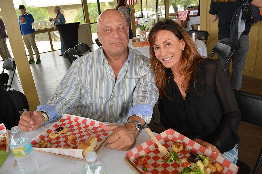 Alan Anderson and Michelle Bennett get lunch in the VIP section through sponsorship by Bulldog Pools.