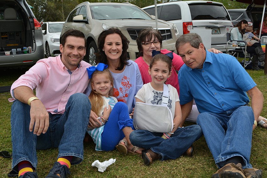 Veterinarian Dr. Adam Sorrells volunteers his skills for Nate's Honor Animal Rescue. He came with his wife, Summer, and children, Lily and Emma. Also pictured are visiting grandparents Alma and Chuck Brinkman.