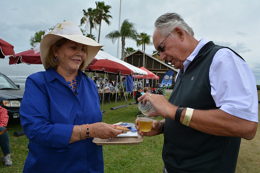 Lakewood Ranch's Carol Belmont serves an apple pie to her husband Gary Corson.