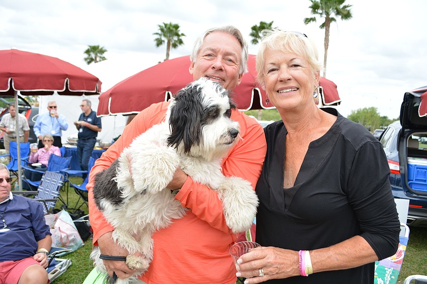 Lakewood Ranch's Bob and Leslie Richards show off their dog, Bandit, who they adopted from Honor.