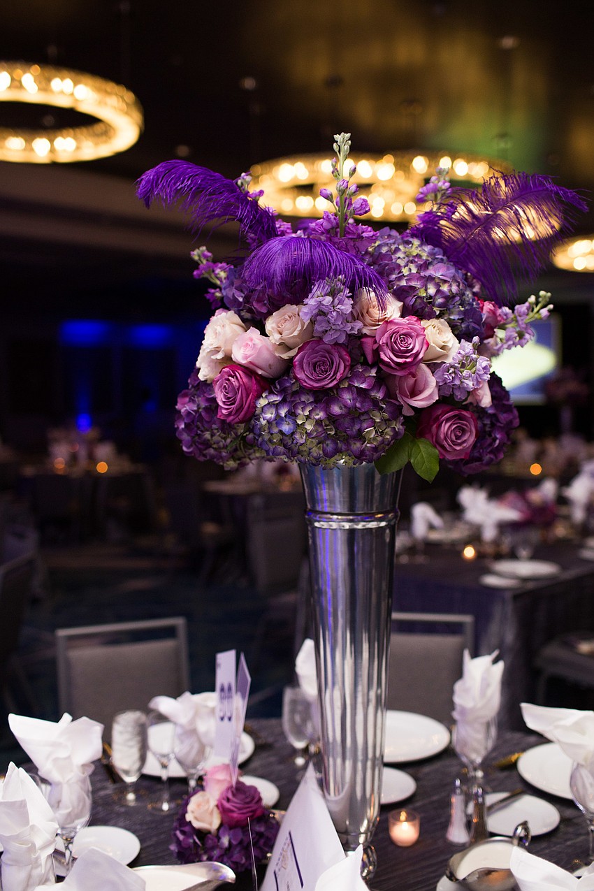 The flower arrangements were provided by Beneva Flowers & Plantscapes