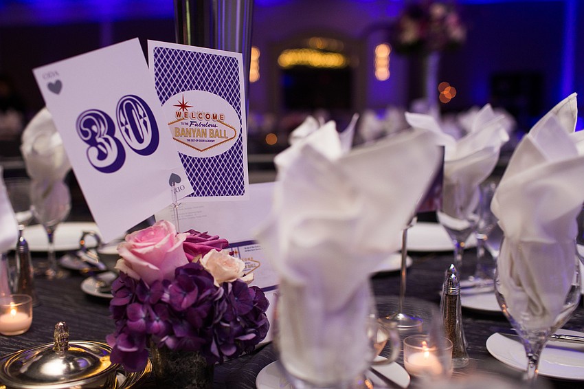 The vintage Vegas theme went into the centerpieces with cards as table numbers.