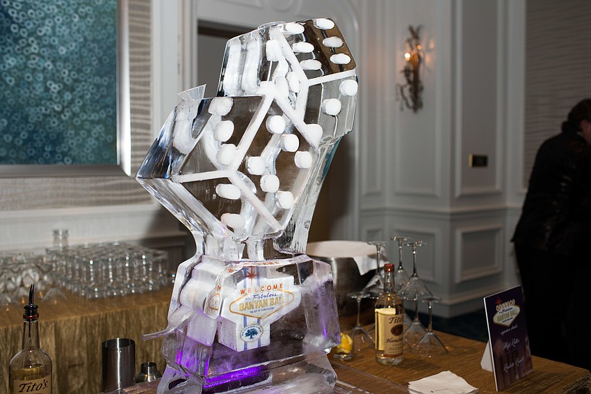 An ice sculpture carved into dice.