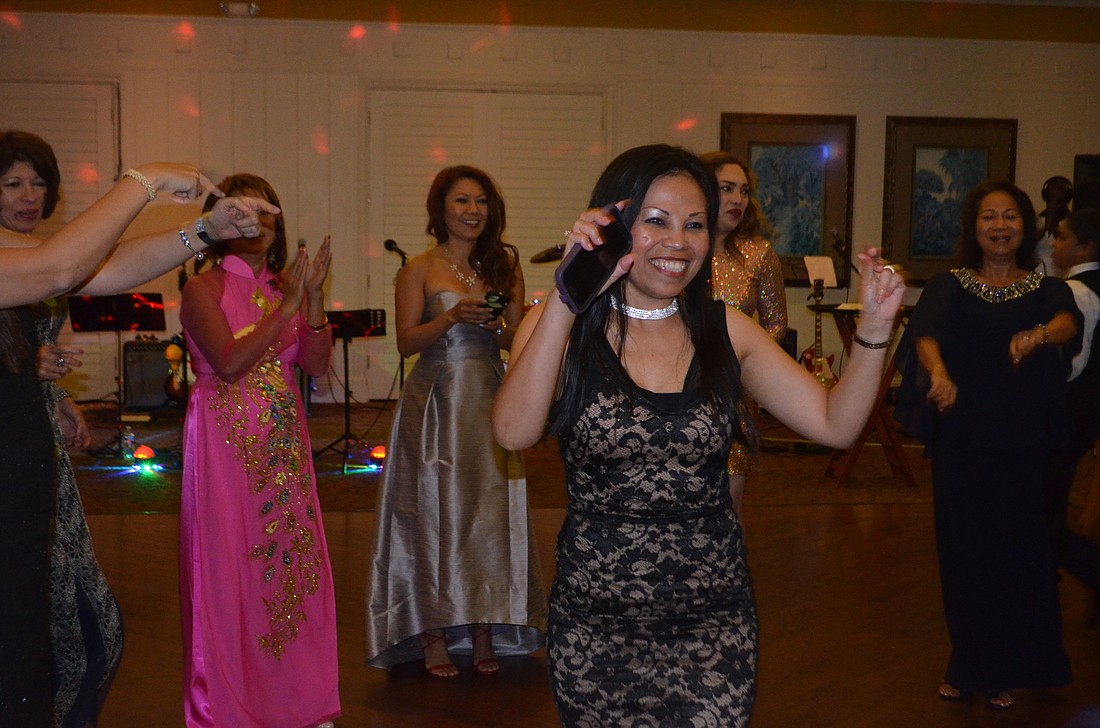 Sarasota&#39;s Nancy Wagner, an Asian Women&#39;s Club member, stepped into the middle of the dance circle created during the Orchid Ball. Photo by Amelia Hanks.