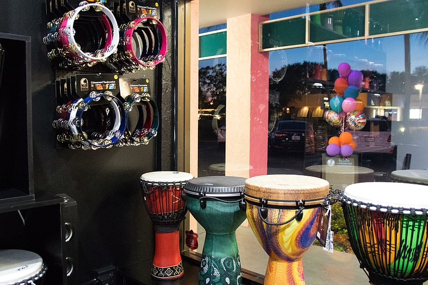 Instruments are displayed along Positive Repercussions' storefront.