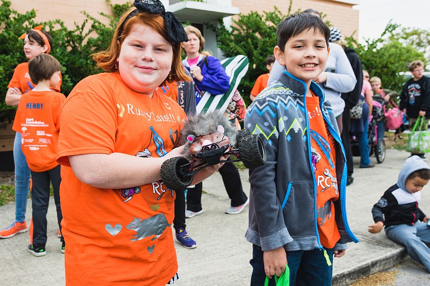 Taytum French and Matthew Brown with their mouse-inspired race car.