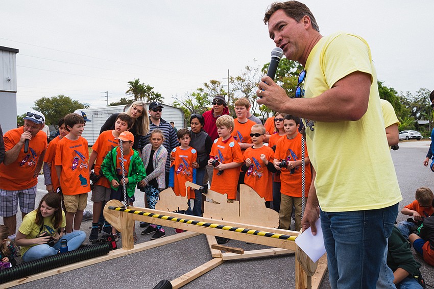 Mitch Ruzek provides commentary for the  drag race.