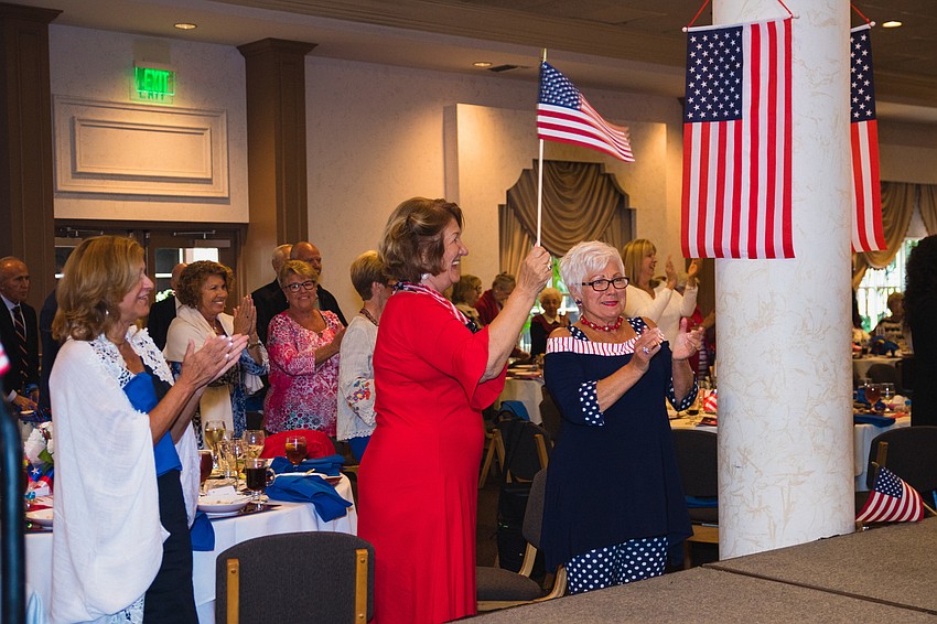 Guests applaud the Sunshine Singers.