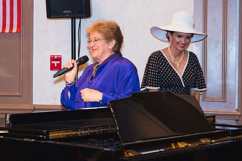 Fashion show commentator Maria Kirlangitis with Dina Hobson.