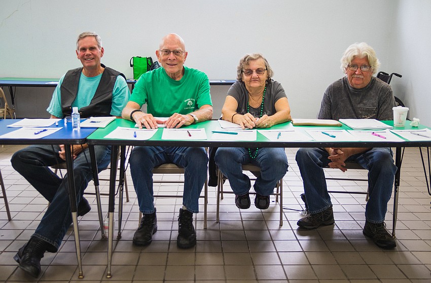 Sarasota HOG volunteers Dave Butler and Allen Sachs with Maggie and Bill Pryor
