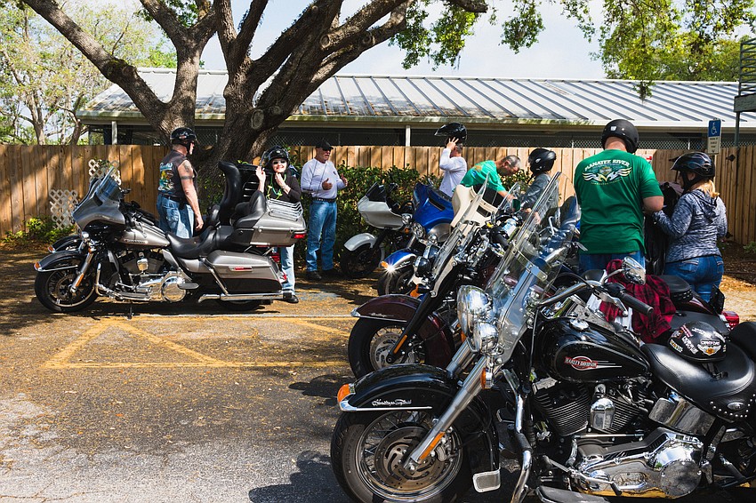 Bikers begin to head out for the poker run.
