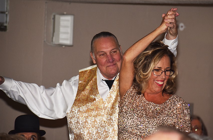 The Rev. Bill Friederich and Bah Hero dance down the aisle.