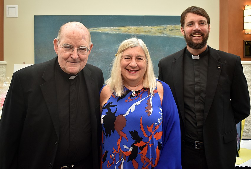 Monsignor Gerry Finegan, Women’s Guild President Ginny Akhoury and the Rev. Eric Scanlan