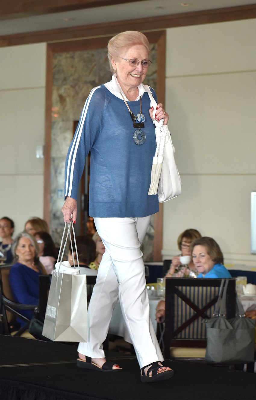 Rita Lynch walks the runway at Sarasota Yacht Club.