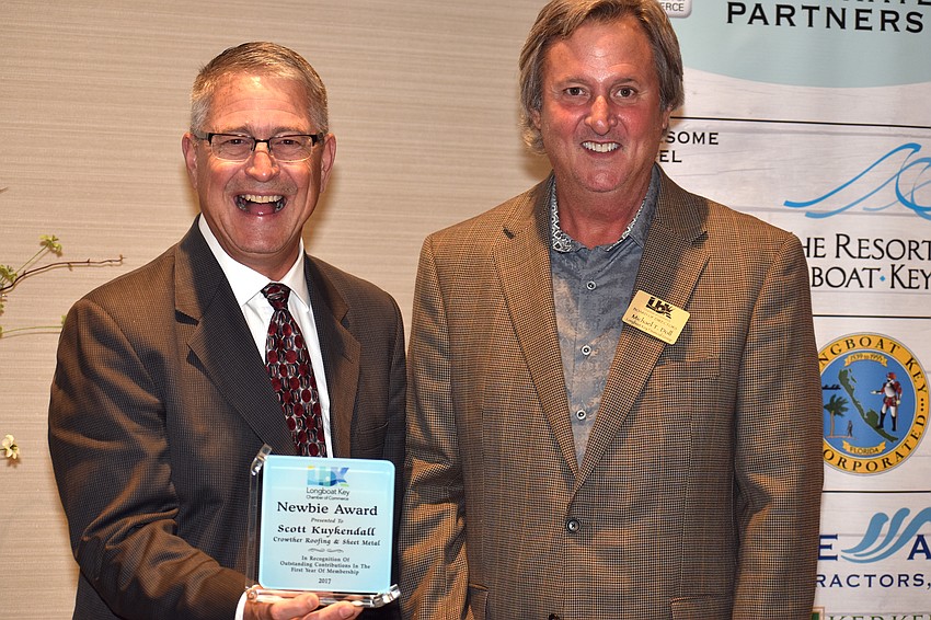 Newbie award winner Scott Kuykendall and 2017 Chamber Chairman Mike Doll