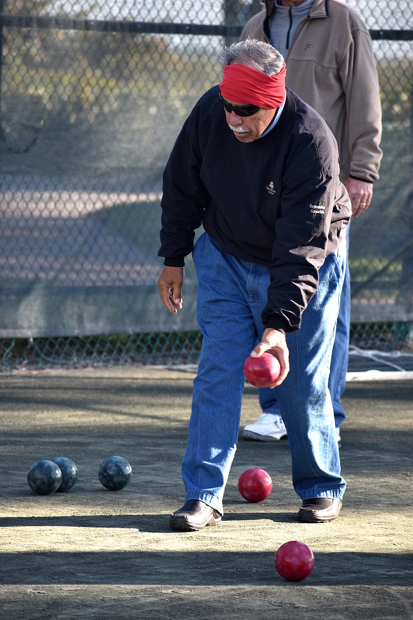 Ron Emmerman lines up the ball before tossing it.
