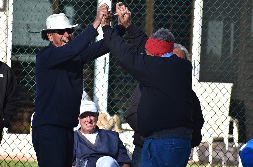 Gerald Daly and Ron Emmerman high five.