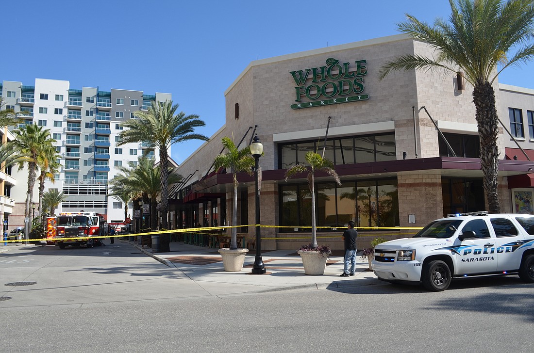 Authorities taped off the entry to the Whole Foods property as they responded to the vehicle fire inside the parking garage.