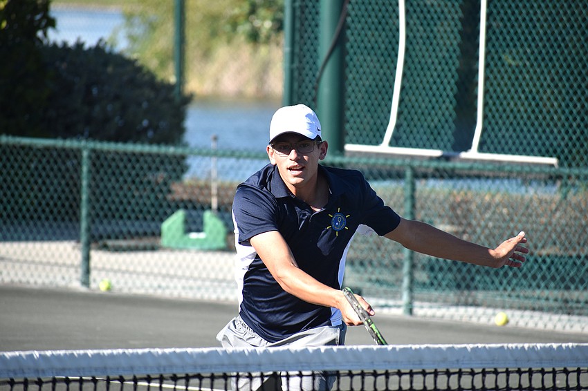 Daniel Dudockin hits the ball during the exhibition.
