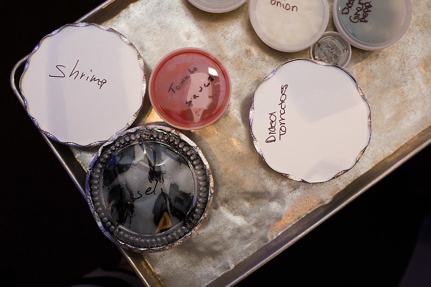 The ingredients for the courses are brought out on a tray.