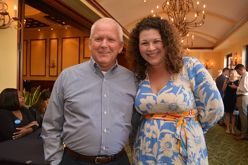 Principal Bill Stenger visits with attendees, including Parent-Teacher Organization President Bianca  Lawrence.