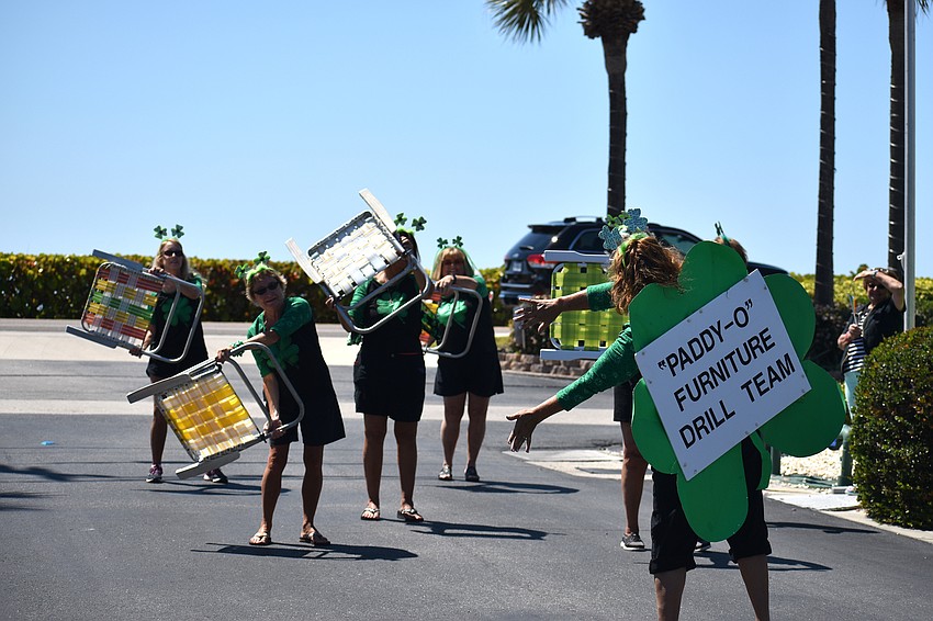 The “Paddy-O” Furniture Drill Team performs their routine during the parade.