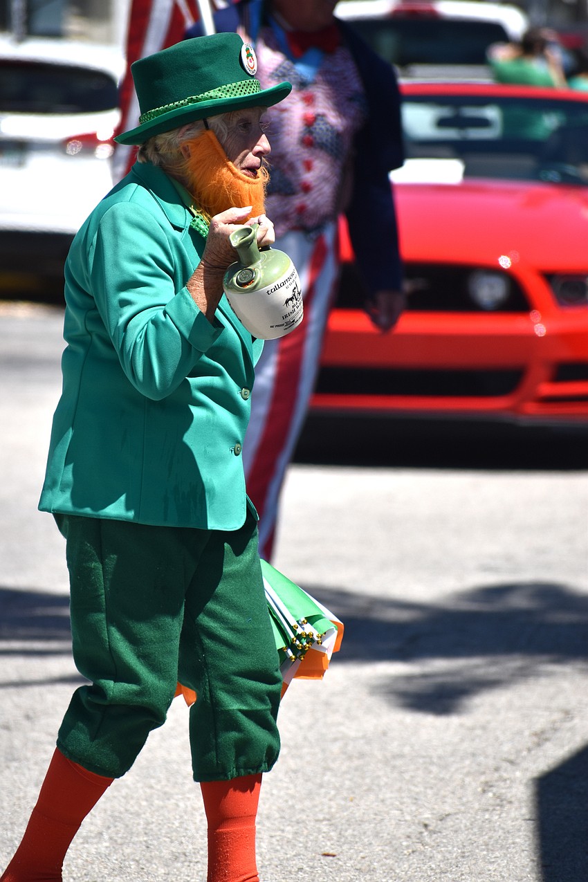 Kay Heigle acts as a leprechaun during the parade.