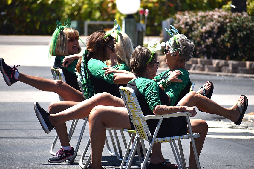 The “Paddy-O” Furniture Drill Team performs their routine during the parade.