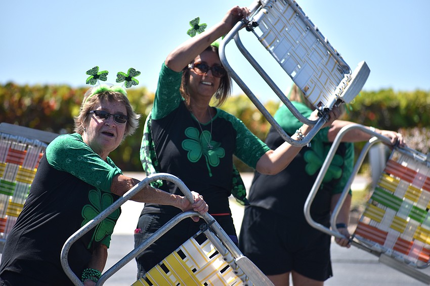 The “Paddy-O” Furniture Drill Team performs their routine during the parade.