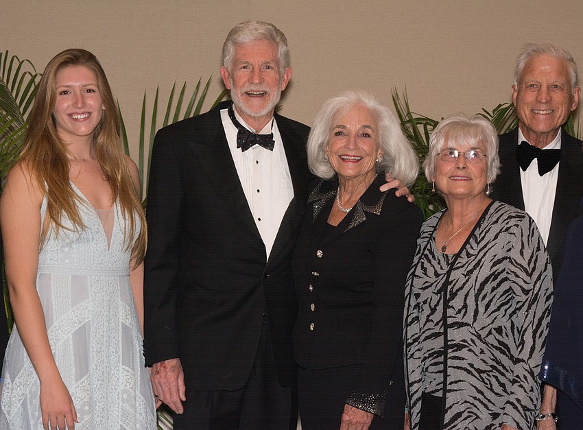 Woman of the Year awardee Graci McGillicuddy, center, with her husband Dennis surrounded by family members