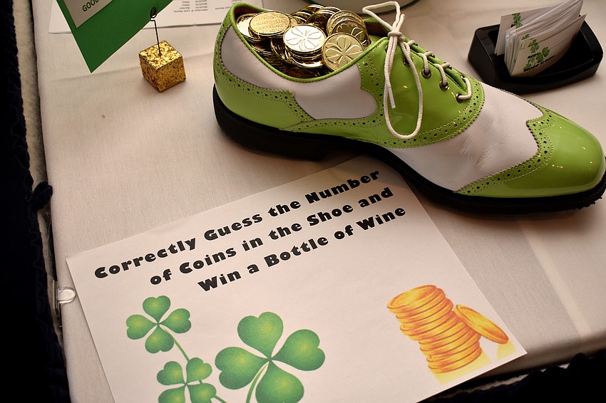 Party goers could guess how many coins were in the shoe to win a bottle of wine.
