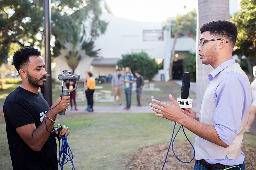 Ringling students Devin Houston and Emad Al-Majtary film for Art Network.