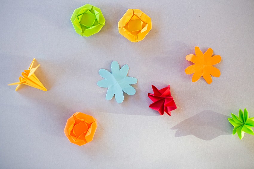 The tables were decorated with colorful origami.