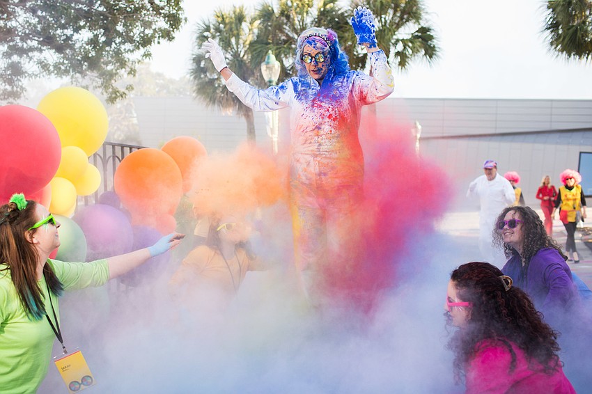 Ringling students threw paint on the Thompsons' white outfits to color them up.