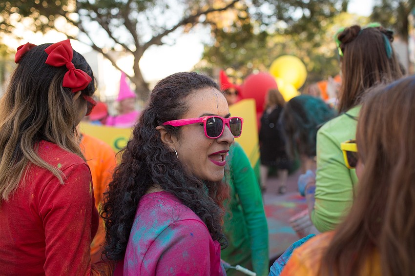Yasmine Encarnacion smiles after throwing paint on the Thompsons.