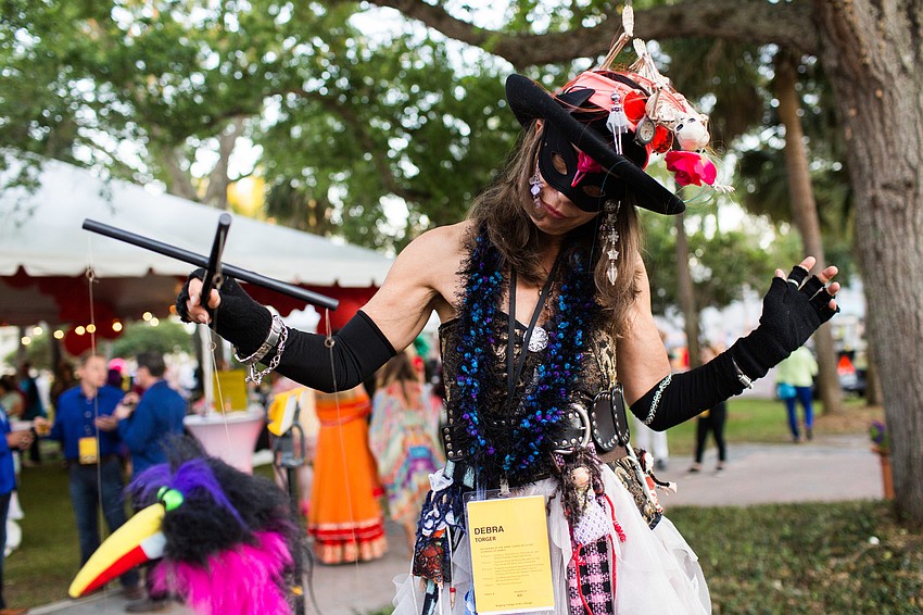 Debra Torger dances with her marionette while Ringling college students draw her.