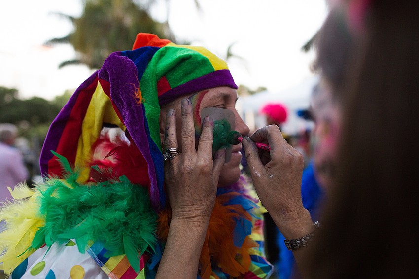 Robyn Fortsch gets her face painted by Pixie Painting.