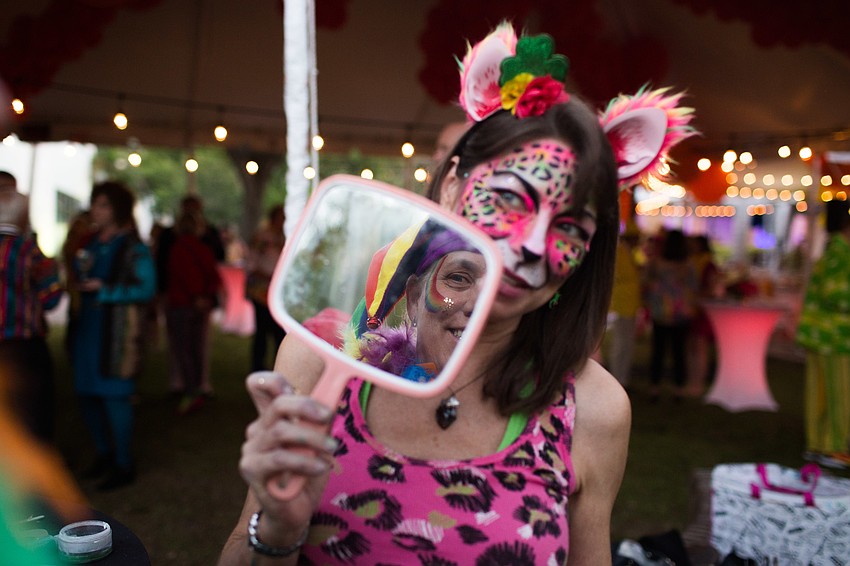 Suzy Kalin shows Robyn Fortsch her face painting.