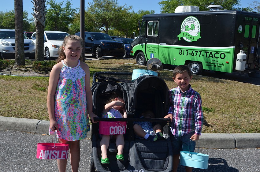 Ainsley,  Corrie,  Eion and Declan Young, of Mill Creek,  bring  personalized Easter egg baskets. This is Ainsley's10th year participating in the egg hunt.