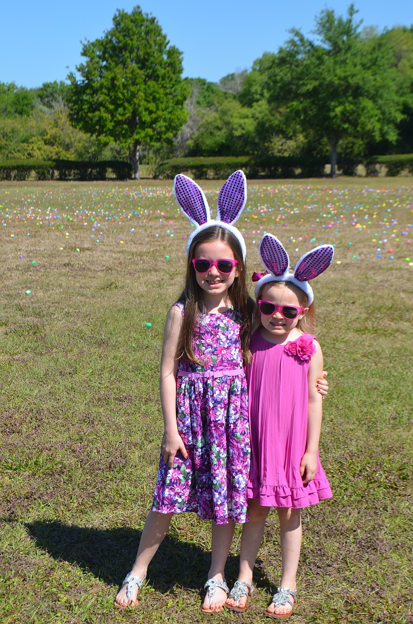 Addison, 7, and Aubrey Sweeney, 4 , were not a fan of their matching bunny ears at the egg hunt.
